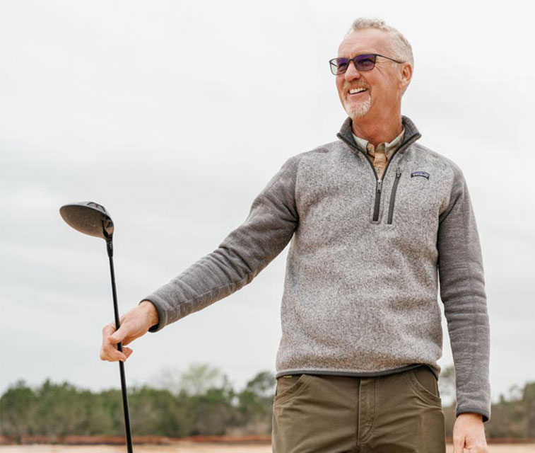 Golfer at Loraloma Club enjoying the 18-hole cliffside golf course in Hill Country